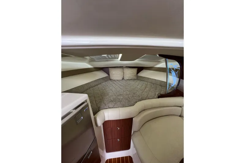 Slide: The Image of 2018 Grady-White Express 370 cabin interior with elegant seating and wooden table. - 24