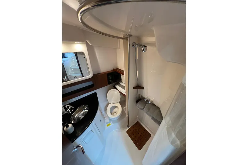 Slide: The Image of 2018 Grady-White Express 370 interior with wooden flooring and curved steps. - 29