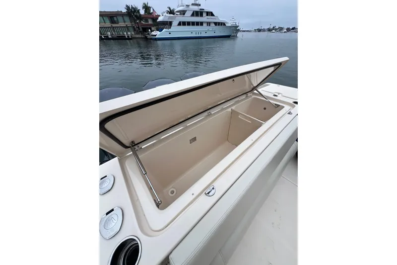 Slide: The Image of 2018 Grady-White Express 370 with triple V8 engines docked in marina. - 3