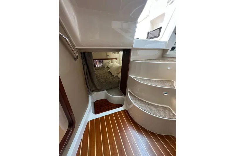 Slide: The Image of Interior of 2018 Grady-White Express 370 boat with wooden flooring and cozy cabin. - 30