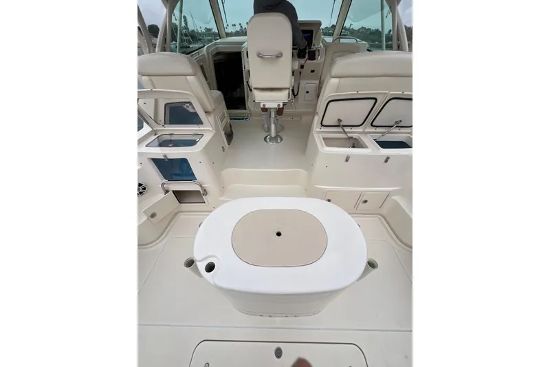 Slide: The Image of 2018 Grady-White Express 370 boat with open storage compartments and water view. - 5
