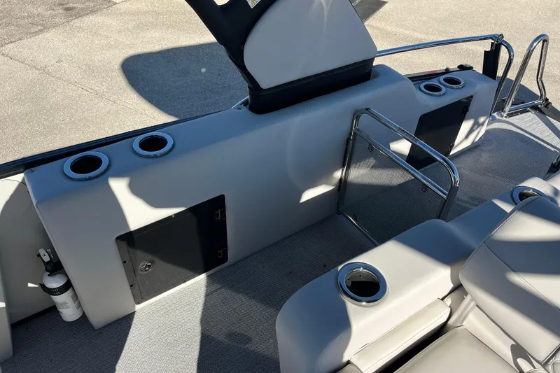 Slide: The Image of 2026 Avalon 2585 Catalina VRB boat interior with cup holders and seating. - 21