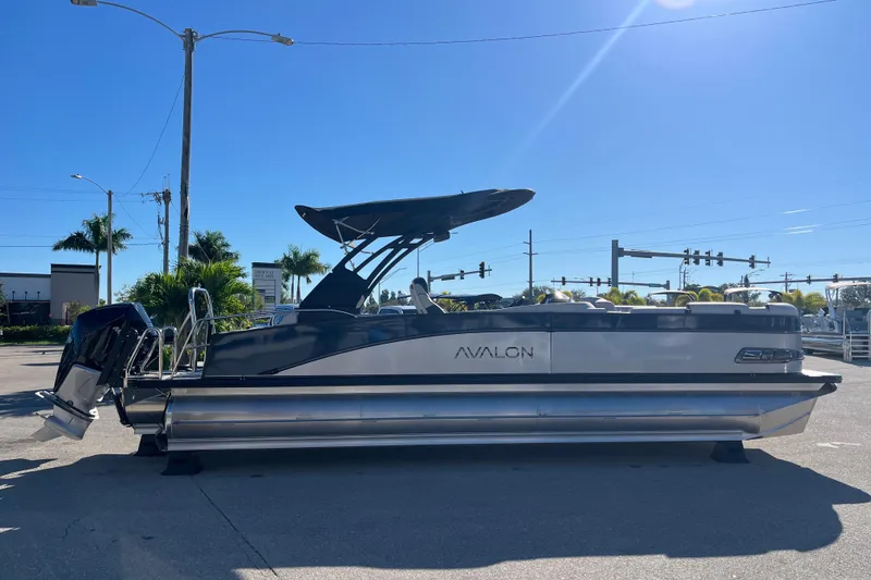 Slide: The Image of 2026 Avalon 2585 Catalina VRB Tri Toon with Mercury 300hp V-8 engine, parked outdoors. - 4