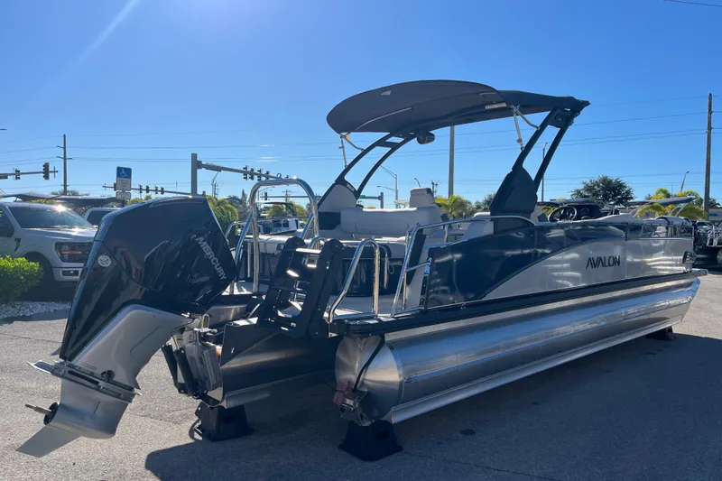 Slide: The Image of 2026 Avalon 2585 Catalina VRB Tri Toon with Mercury 300hp V-8 engine, parked outdoors. - 5