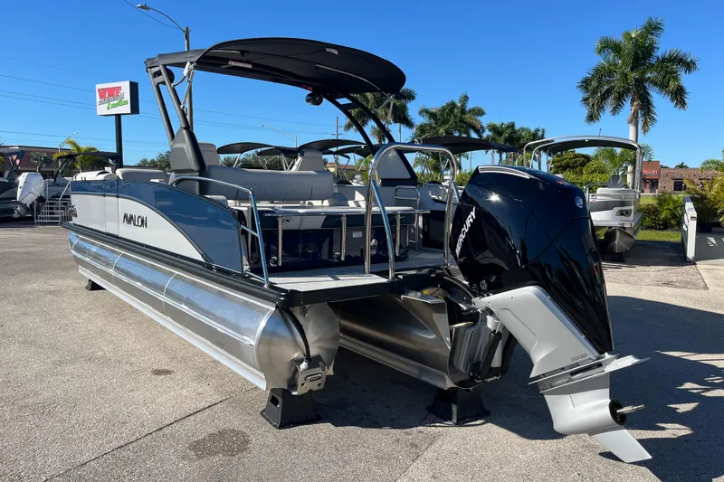 Slide: The Image of 2026 Avalon 2585 Catalina VRB Tri Toon with Mercury 300hp V-8 engine, parked outdoors. - 7