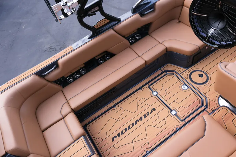 Slide: The Image of Luxurious interior of 2026 Moomba Tykon boat with tan seating and stylish flooring. - 13