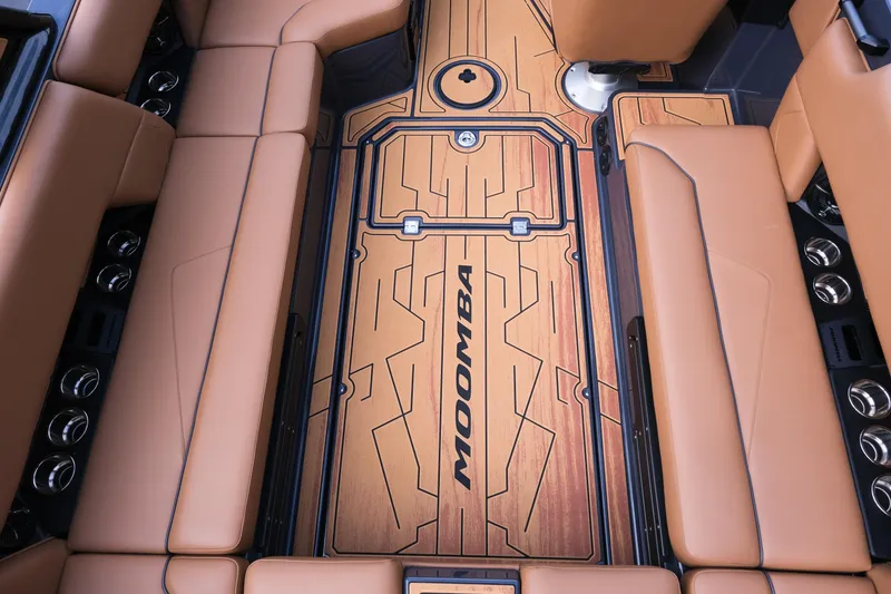 Slide: The Image of Luxurious interior of 2026 Moomba Tykon boat with tan seating and stylish flooring. - 14