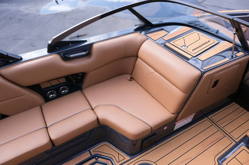 Slide: The Image of 2026 Moomba Tykon boat interior with tan leather seating and sleek design. - 18