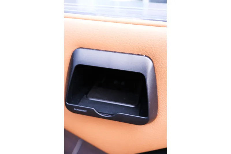 Slide: The Image of 2026 Moomba Tykon interior door handle with tan leather trim. - 23