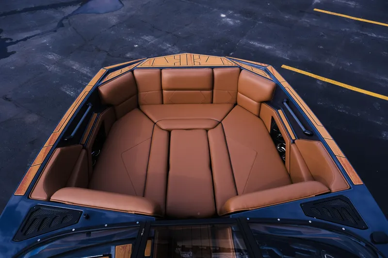 Slide: The Image of Luxurious interior of 2026 Moomba Tykon boat with tan leather seating. - 26