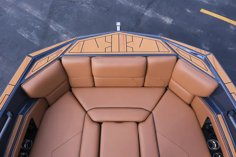 Slide: The Image of 2026 Moomba Tykon boat interior with tan leather seating and stylish design. - 28