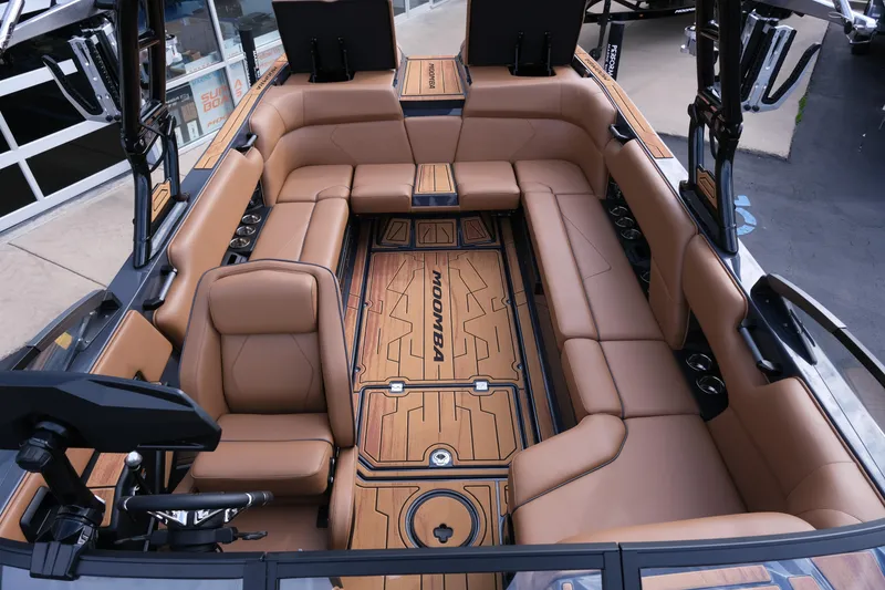 Slide: The Image of Luxurious interior of 2026 Moomba Tykon boat with tan leather seating and sleek design. - 30