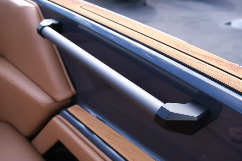 Slide: The Image of 2026 Moomba Tykon interior detail with sleek handrail and luxurious leather seating. - 31