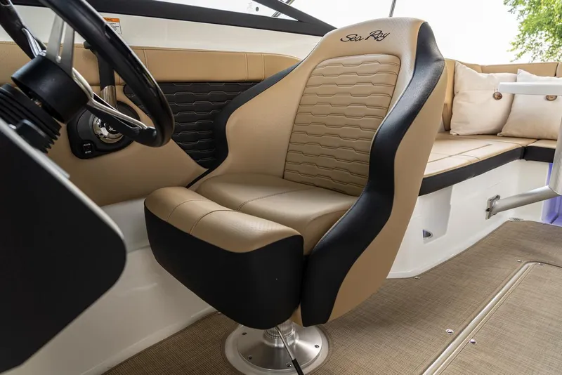 Slide: The Image of Manufacturer Provided Image: 2024 Sea Ray SPX 230 boat interior with tan and black captain's chair. - 18