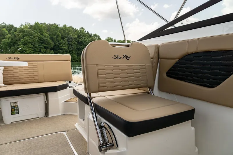 Slide: The Image of Manufacturer Provided Image: 2024 Sea Ray SPX 230 boat interior with tan seating and lake view. - 20
