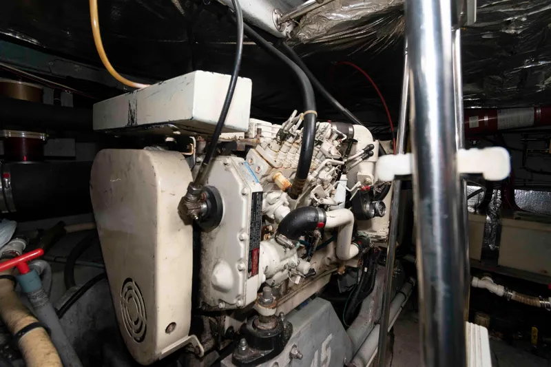Slide: The Image of Engine room of a 1995 Sea Ray 440 Sundancer yacht, showcasing mechanical components. - 18