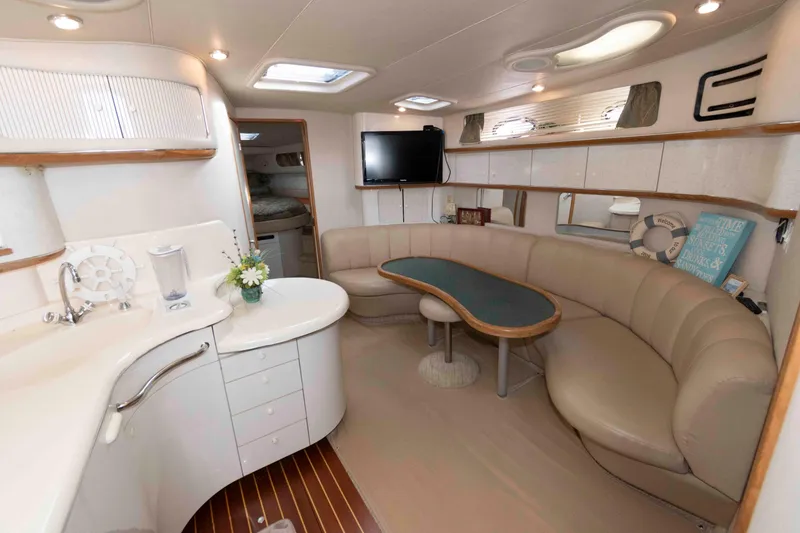 Slide: The Image of Luxurious interior of 1995 Sea Ray 440 Sundancer yacht with elegant seating and modern amenities. - 8