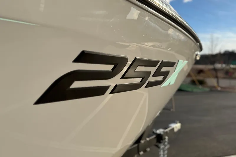 Slide: The Image of 2026 Yamaha Boats 255XD model logo on sleek white hull. - 13