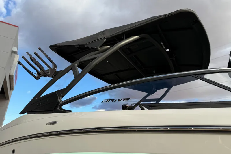 Slide: The Image of 2026 Yamaha Boats 255XD with sleek design and modern features under a cloudy sky. - 14