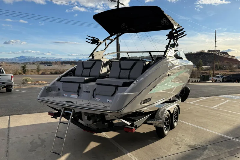 Slide: The Image of 2026 Yamaha Boats 255XD on trailer, sleek design, outdoor setting. - 8