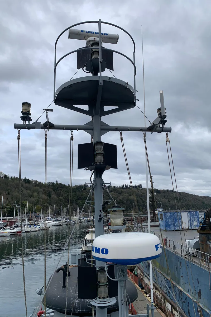 Slide: The Image of 1955 Tugboat L-T 100 Steel Army Tug with radar equipment, docked in a marina. - 11