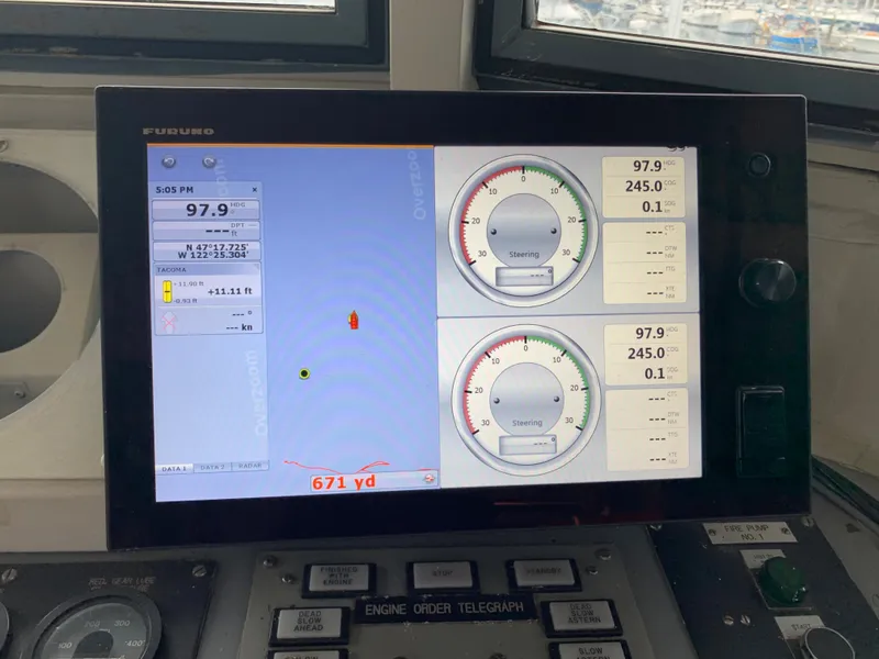 Slide: The Image of Control panel of a 1955 Tugboat L-T 100 Steel Army Tug, displaying navigation data. - 21