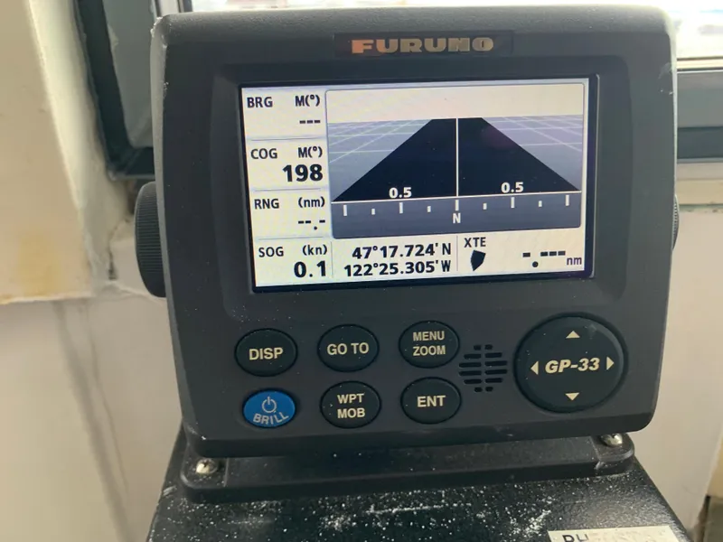 Slide: The Image of Navigation display on 1955 Tugboat L-T 100 Steel Army, showing coordinates and course. - 23