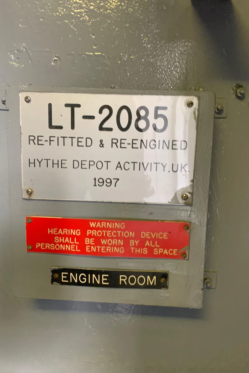 Slide: The Image of 1955 Tugboat L-T 100 Steel Army Tug, refitted in 1997, engine room warning signs. - 26