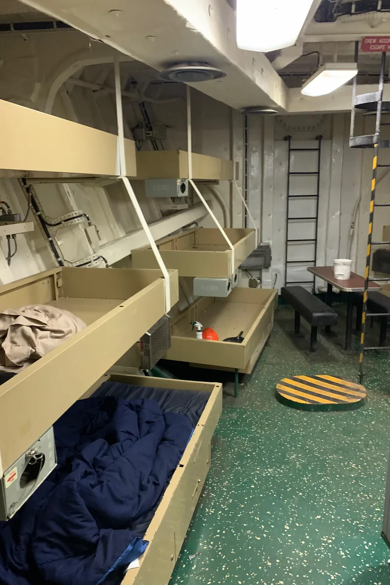 Slide: The Image of Interior of 1955 L-T 100 Steel Army Tugboat with bunk beds and ladder. - 27