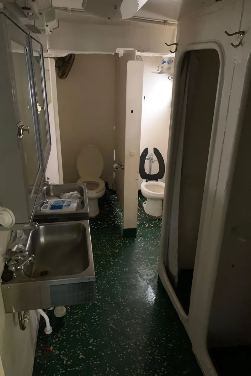 Slide: The Image of Interior of 1955 L-T 100 Steel Army Tugboat bathroom with sink and toilet. - 28