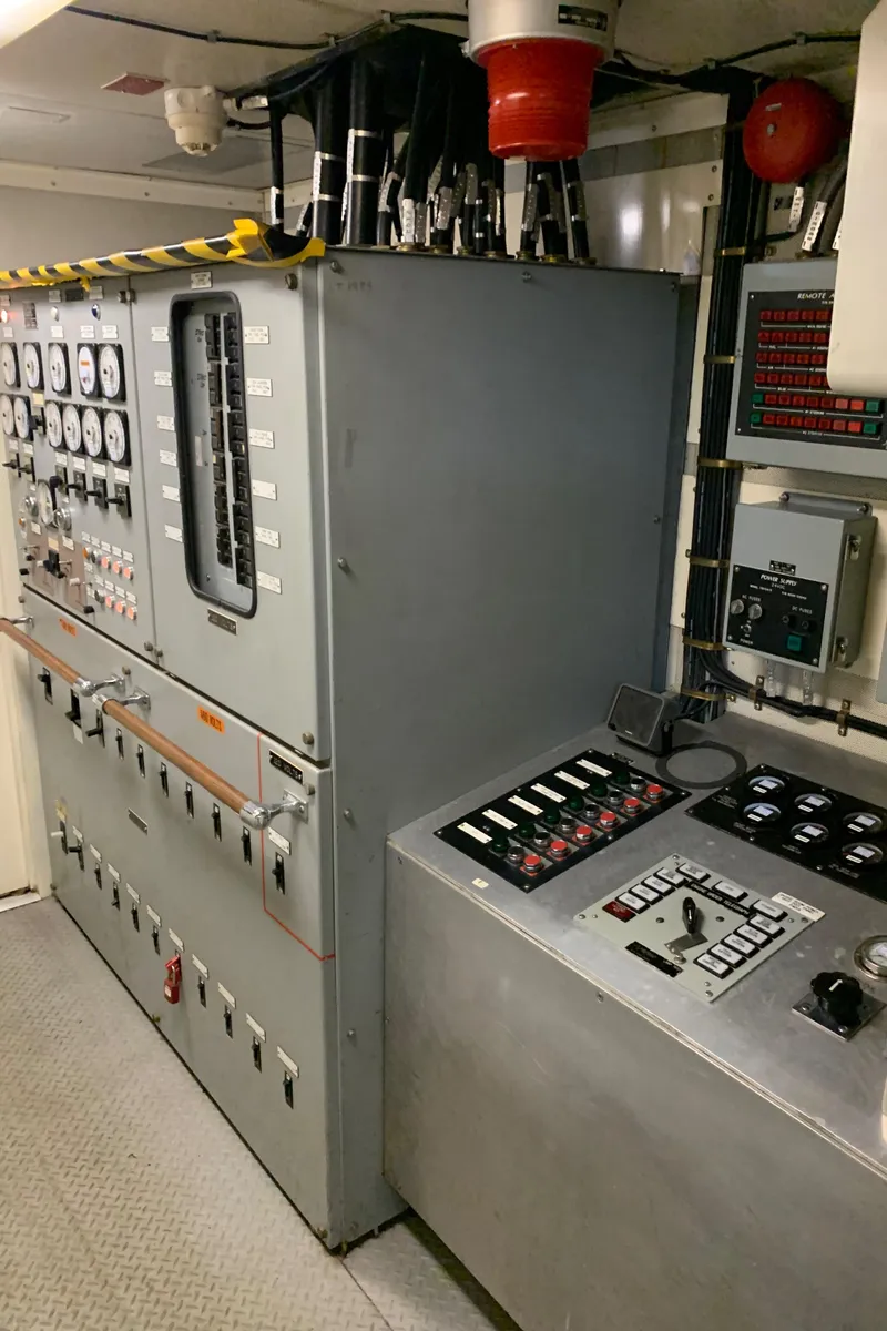 Slide: The Image of Control room of 1955 Tugboat L-T 100 Steel Army Tug with gauges and switches. - 29