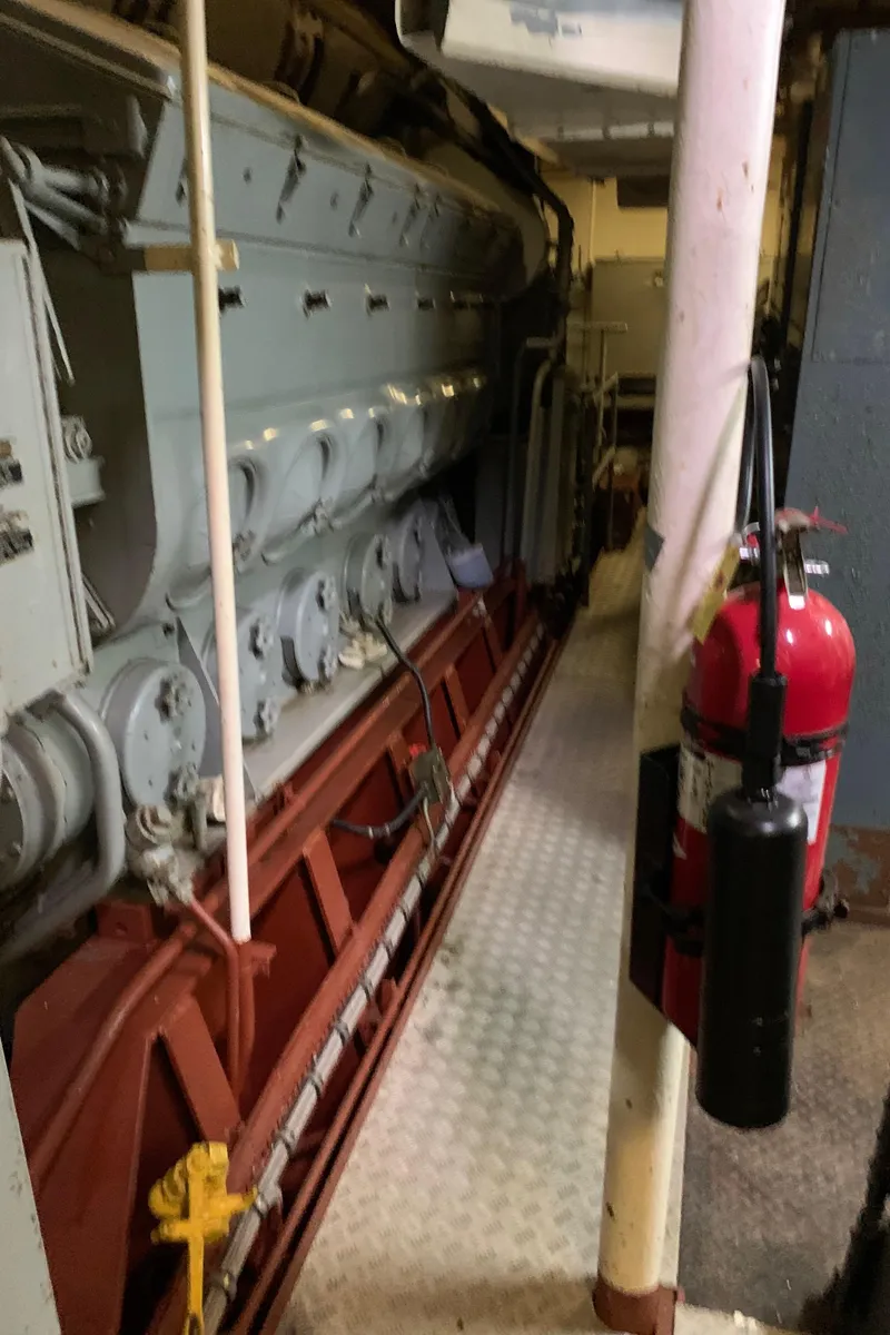 Slide: The Image of Engine room of 1955 Tugboat L-T 100 Steel Army Tug with fire extinguisher. - 30