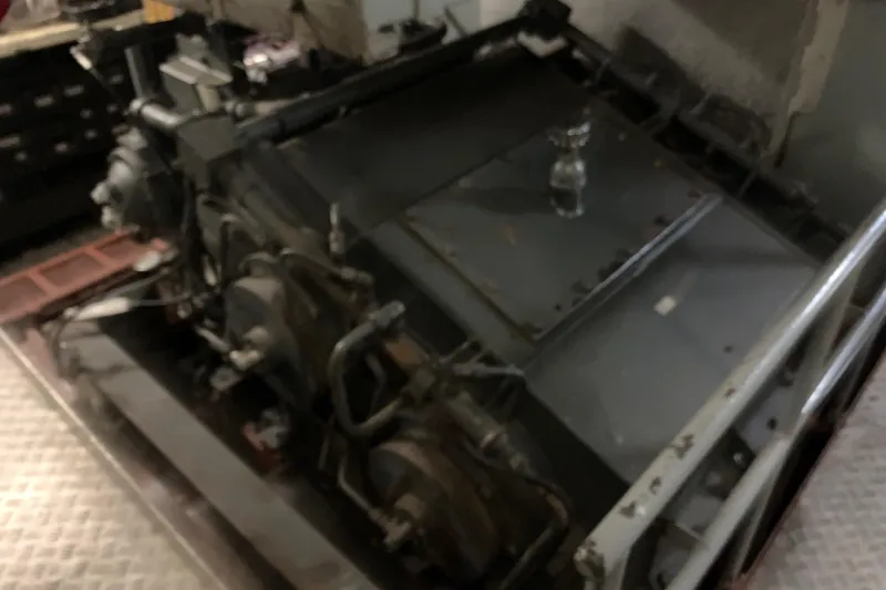 Slide: The Image of 1955 L-T 100 Steel Army Tug engine, showcasing mechanical components and industrial design. - 33