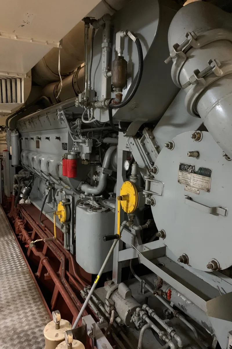 Slide: The Image of Engine room of 1955 Tugboat L-T 100 Steel Army Tug, showcasing mechanical components. - 35