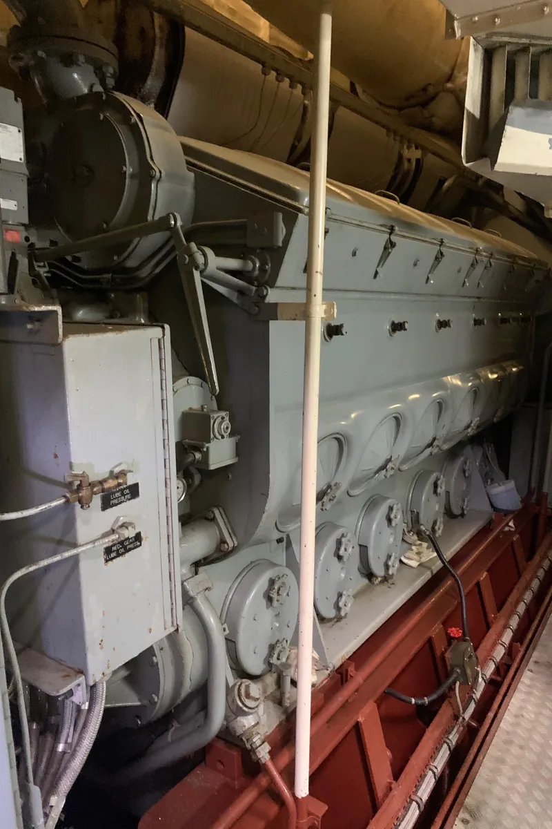 Slide: The Image of Engine room of 1955 Tugboat L-T 100 Steel Army Tug, showcasing machinery. - 37