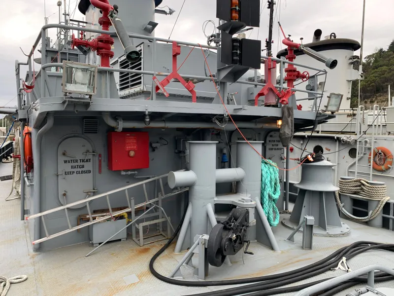 Slide: The Image of 1955 L-T 100 Steel Army Tugboat deck with equipment and safety features. - 4