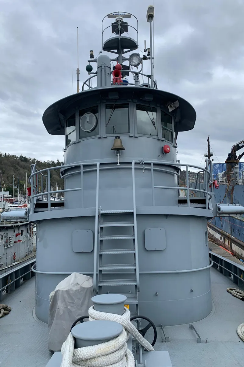 Slide: The Image of 1955 L-T 100 Steel Army Tugboat with gray exterior and nautical equipment. - 9