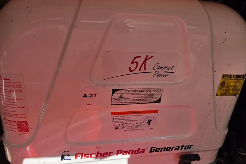 Slide: The Image of Fischer Panda 5K Compact Power generator on 2024 Pursuit OS 325 Offshore boat. - 64