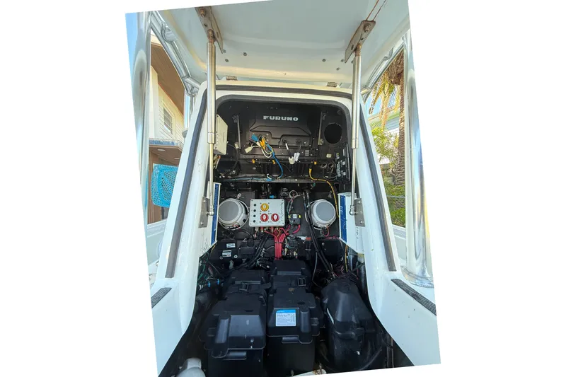 Slide: The Image of 2016 Yellowfin 24 Bay boat electronics and wiring setup inside the console. - 11