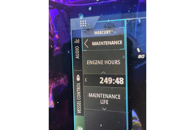 Slide: The Image of Display screen showing Mercury engine maintenance hours at 249:48 on a 2016 Yellowfin 24 Bay. - 15