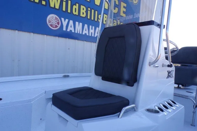 Slide: The Image of 2026 Xpress H20B Bay boat seat with black cushion, near Yamaha sign. - 10