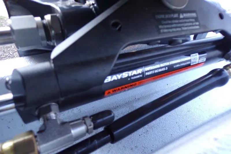 Slide: The Image of Close-up of BayStar hydraulic steering system on 2026 Xpress H20B Bay boat. - 3