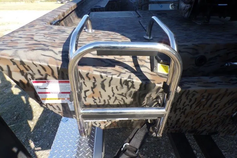 Slide: The Image of Stainless steel ladder on 2026 Xpress H20B Bay boat with camouflage pattern. - 18