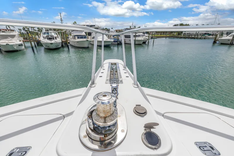 Slide: The Image of Bow view of 1999 Viking 72 Enclosed Bridge yacht docked in marina. - 17