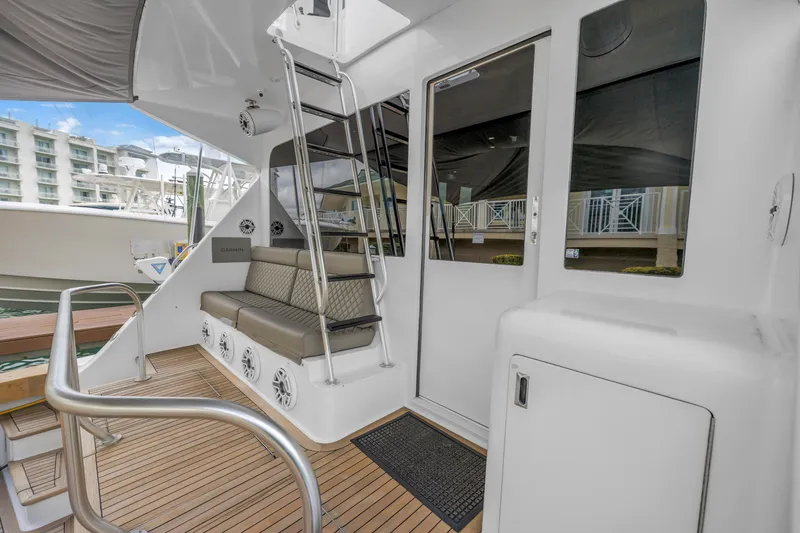 Slide: The Image of 1999 Viking 72 Enclosed Bridge yacht with seating, ladder, and teak deck. - 30