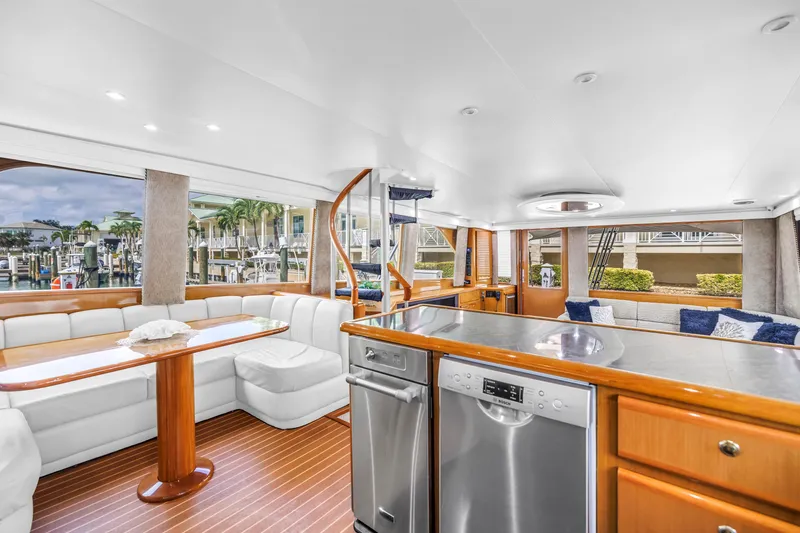 Slide: The Image of Luxurious interior of 1999 Viking 72 Enclosed Bridge yacht with modern amenities and elegant design. - 36