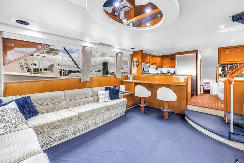 Slide: The Image of Luxurious interior of 1999 Viking 72 Enclosed Bridge yacht with modern furnishings and elegant design. - 42