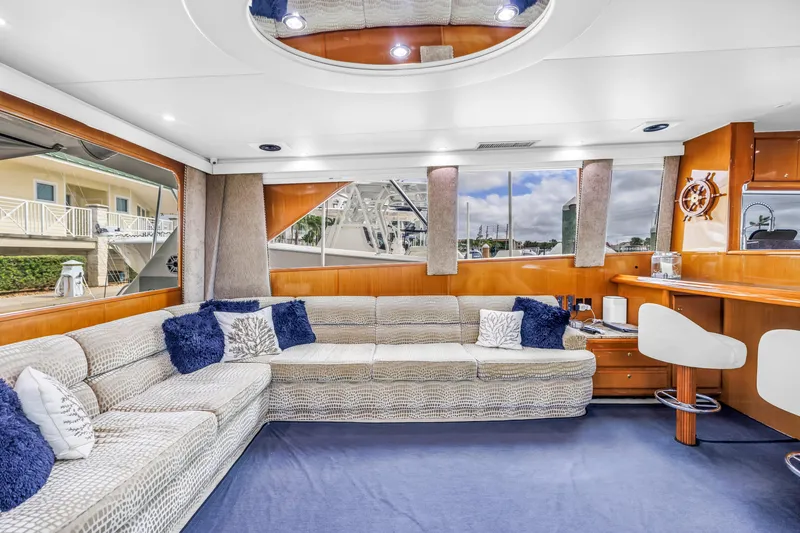 Slide: The Image of Luxurious interior of 1999 Viking 72 Enclosed Bridge yacht with plush seating and elegant decor. - 43