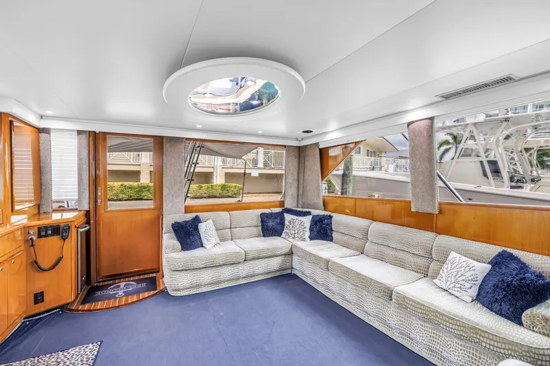 Slide: The Image of Luxurious interior of 1999 Viking 72 Enclosed Bridge yacht with plush seating and elegant decor. - 46