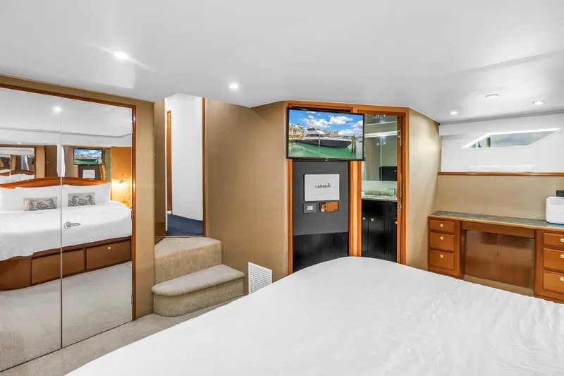 Slide: The Image of Luxurious interior of 1999 Viking 72 Enclosed Bridge yacht with modern amenities. - 59